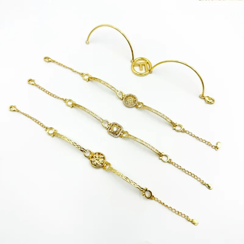 Gold vintage bar charm bracelets set with engraved bar chain designs, round decorative charms, adjustable extension chains and open bangle style for wholesale jewelry buyers