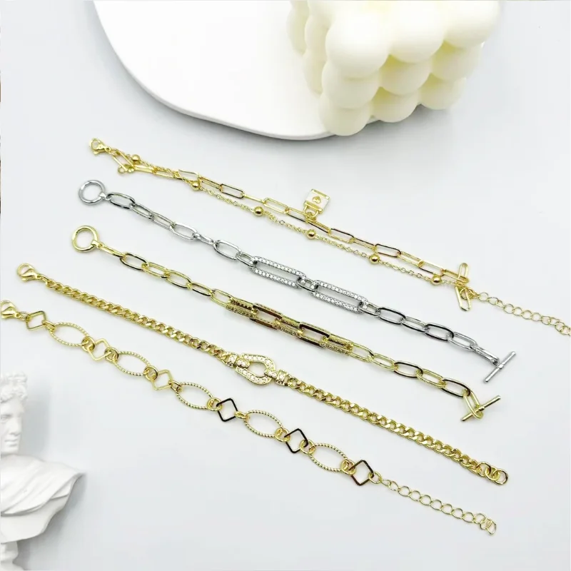 Mixed metal chain link bracelets set with gold and silver-tone paperclip chain designs, rhinestone link details, toggle clasp styles and layered chain bracelets for wholesale jewelry buyers