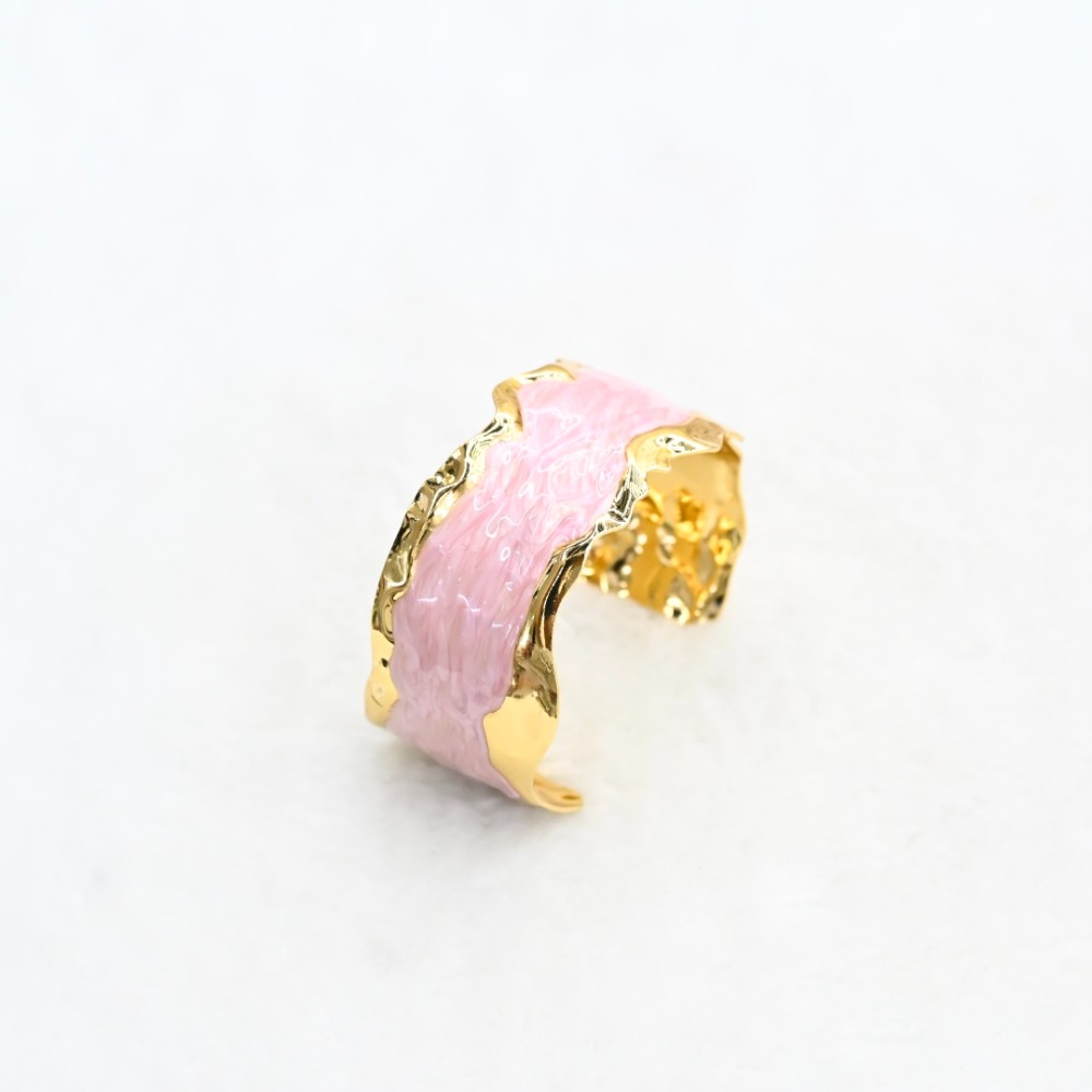 Pink marble-style gold cuff bracelet with irregular hammered gold-tone edges and open adjustable design for wholesale jewelry buyers