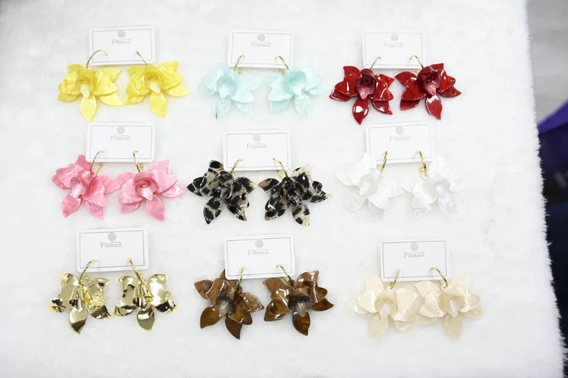 Colorful flower petal drop earrings set with yellow, aqua, red, pink, leopard, white, gold, brown and cream floral designs for wholesale jewelry buyers