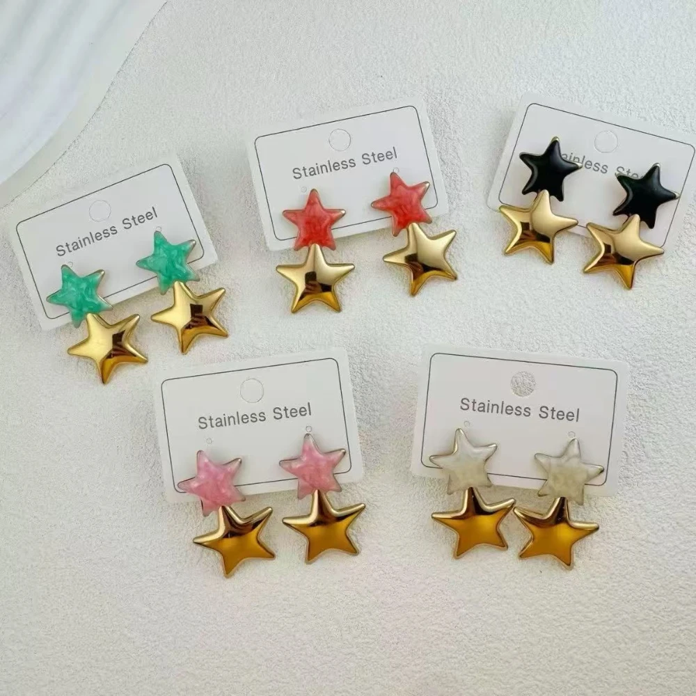 Assorted colorful star drop earrings with green, red, black, pink and white star tops and gold-tone star charms for wholesale jewelry buyers