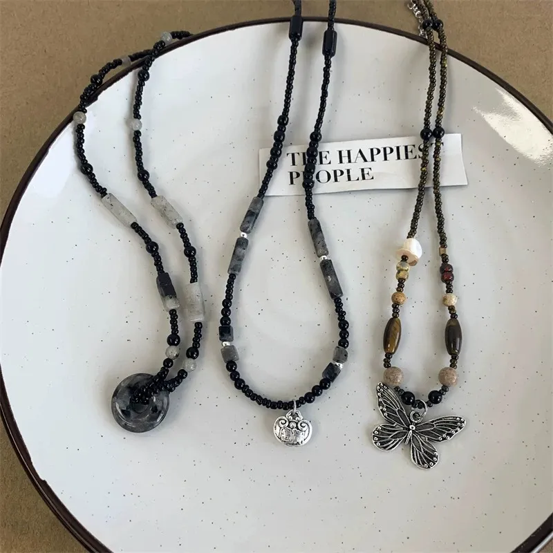 Black stone butterfly beaded necklaces set with round pendant, metal charm, natural stone beads and vintage butterfly pendant designs for wholesale jewelry buyers