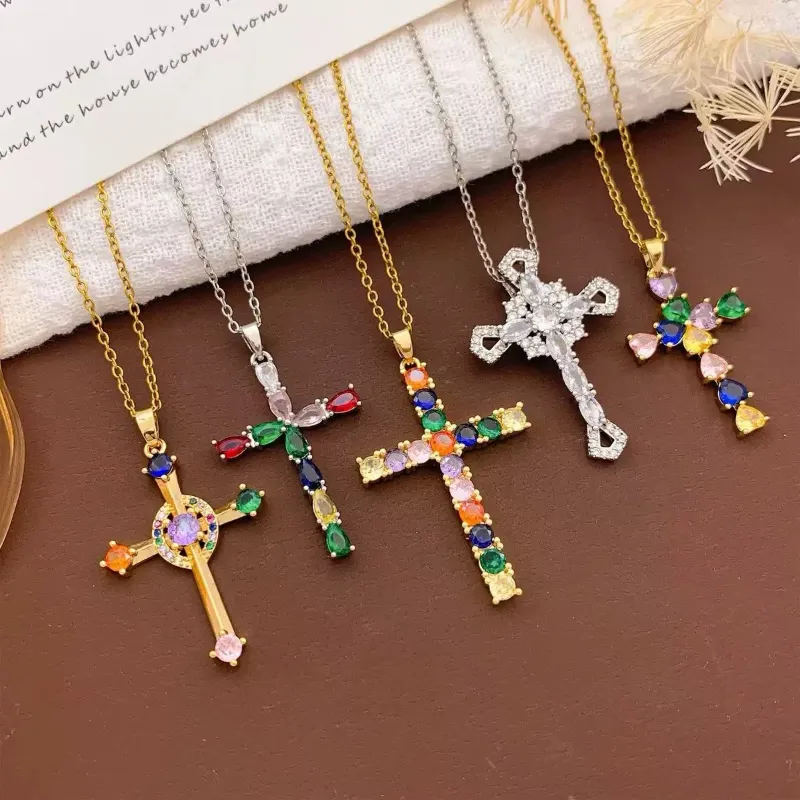 Colorful crystal cross necklaces set with gold and silver chain designs, multicolor stone pendants and rhinestone cross styles for wholesale jewelry buyers