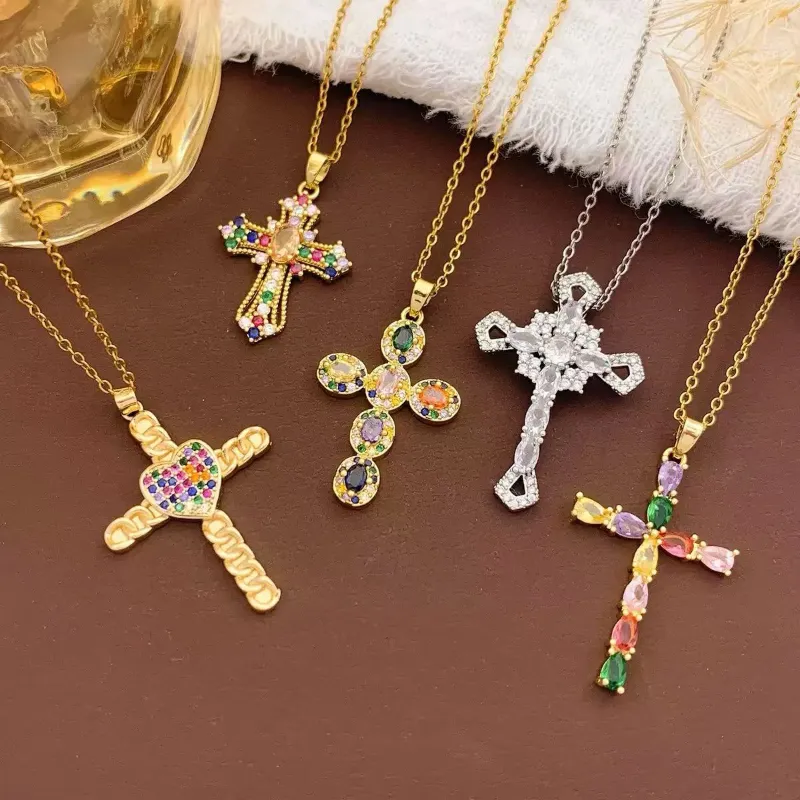 Colorful crystal cross pendant necklaces set with gold and silver chains, multicolor rhinestone cross designs and religious gift jewelry styles for wholesale jewelry buyers