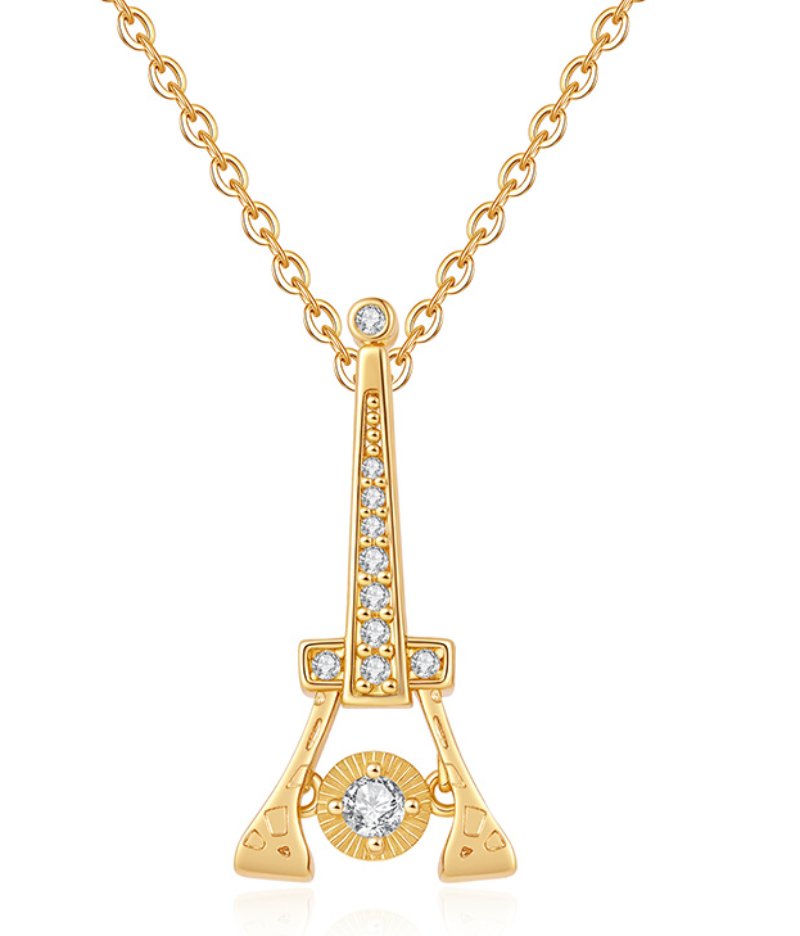 Gold Eiffel Tower pendant necklace with rhinestone details, fine chain and Paris-inspired travel jewelry style for wholesale jewelry buyers