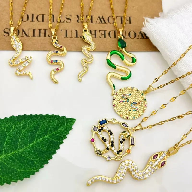 Gold snake crystal pendant necklaces set with snake pendant, crystal details and animal statement necklace styling for wholesale jewelry buyers