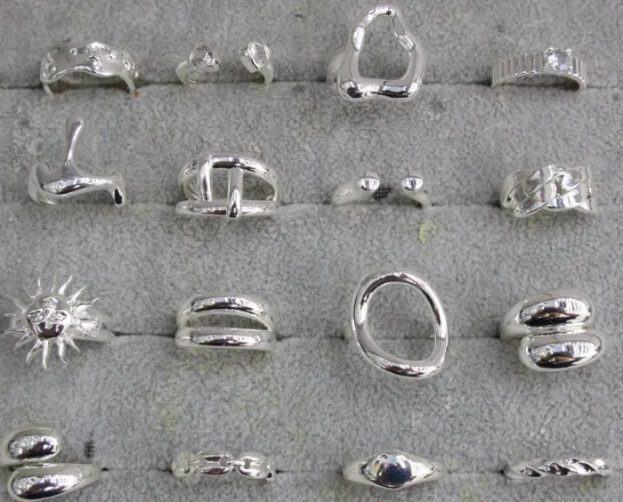 Silver geometric open Bagues Set with Cœur, sun, Chaîne, Ovale, wave, bead, tearPendentif and abstract Statement Bague designs displayed in a tray for wholesale jewelry buyers