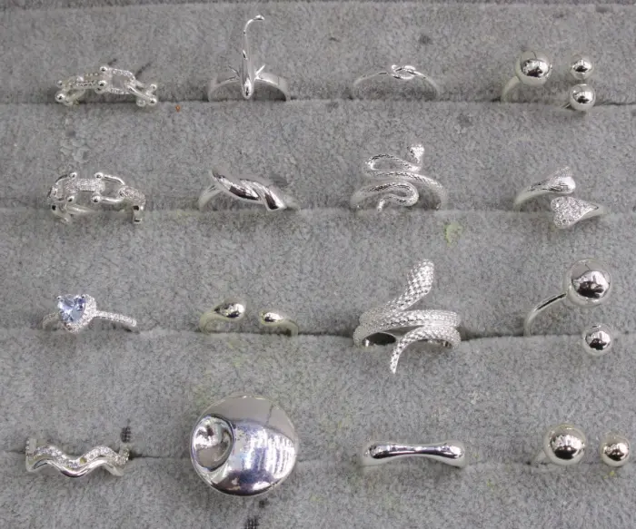 Silver open Statement Bagues Set with bead, Serpent, tearPendentif, Cœur Cristal, wave, dome and abstract Bague designs displayed in a tray for wholesale jewelry buyers